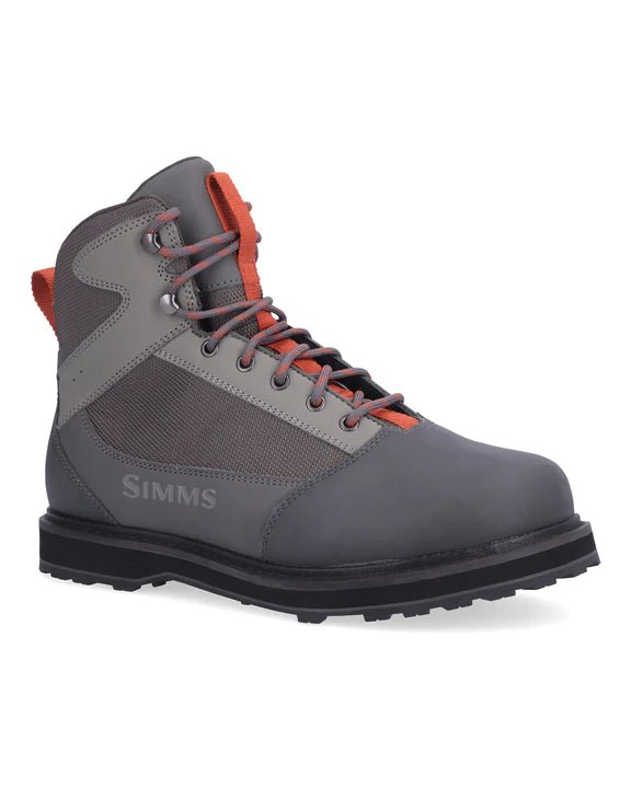 Simms Tributary Wading Boot - Rubber Soles in Basalt showcasing a sturdy construction, rubber soles for traction, and a comfortable fit, ideal for providing stability and protection during fishing trips.