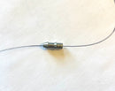 Fishing line passing through the center of a Queen Tackle tungsten nail weight